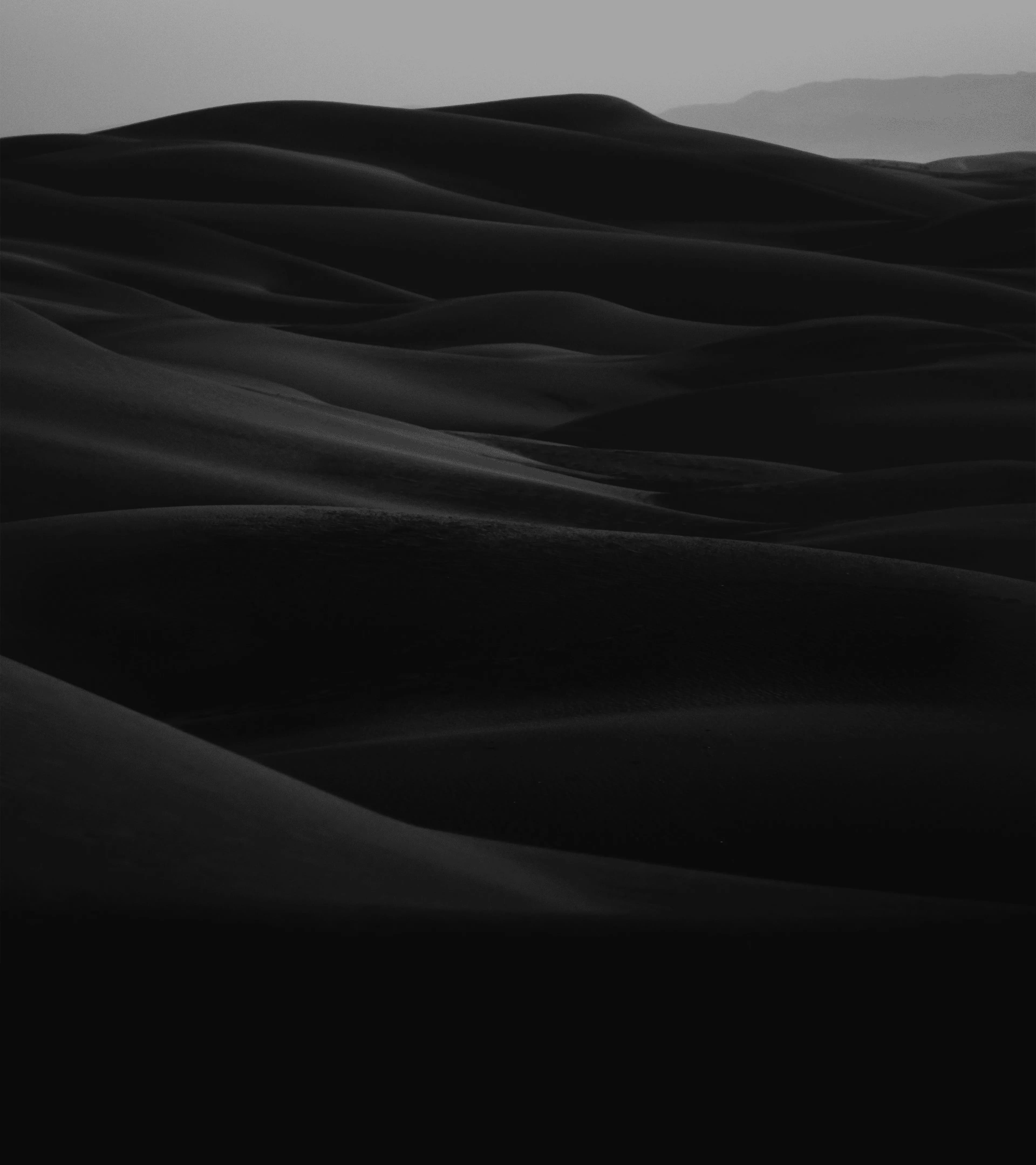 Website Background: A monotone image of a mountain range